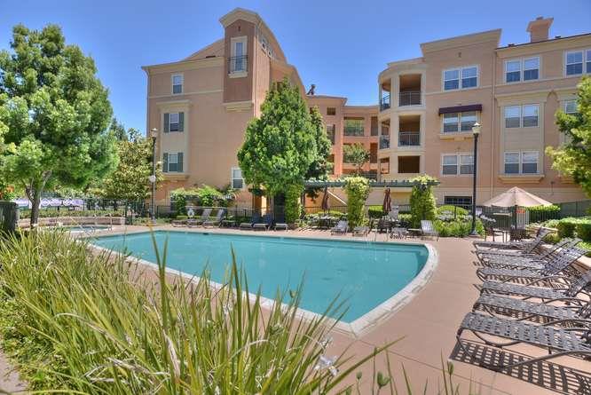 1310 Saddle Rack Street, Unit 432 San Jose, CA 95126 - Photo 10 of 10 a view of swimming pool with outdoor seating and a garden
