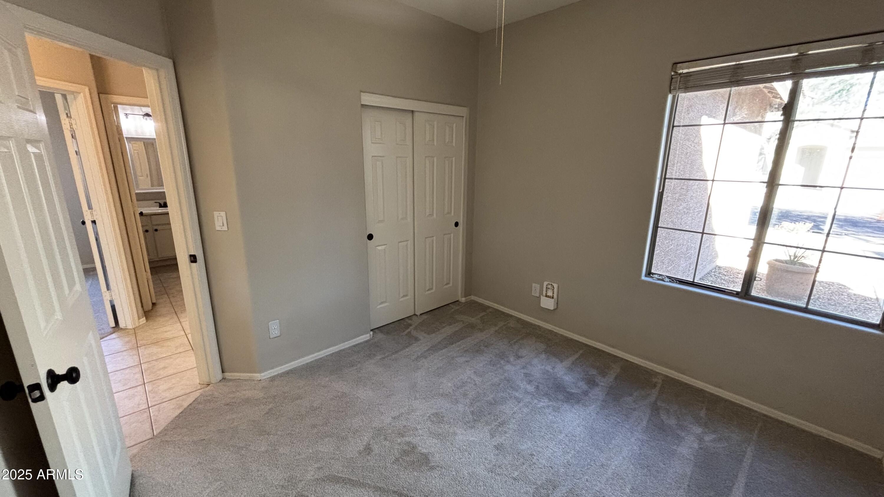 2587 West Patagonia Way Phoenix, AZ 85086 - Photo 17 of 19 a view of an empty room with a window