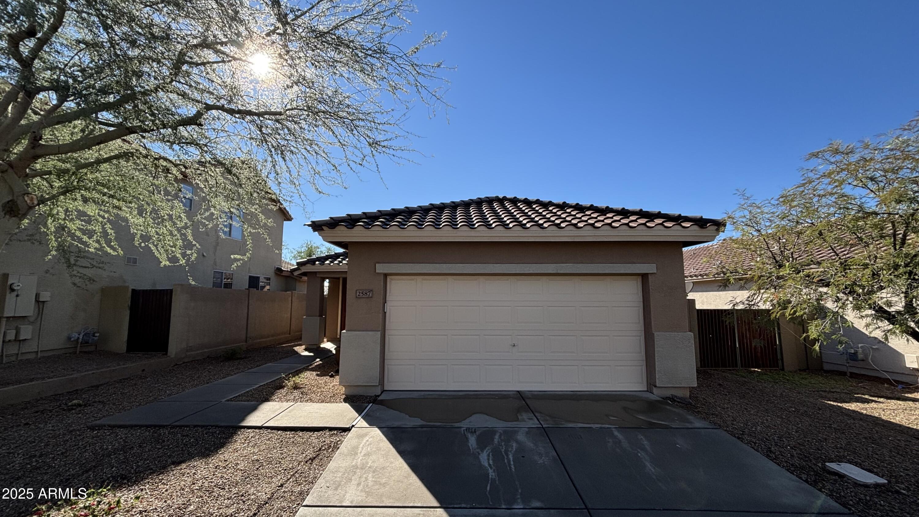 2587 West Patagonia Way Phoenix, AZ 85086 - Photo 2 of 19 a front view of a house with a yard