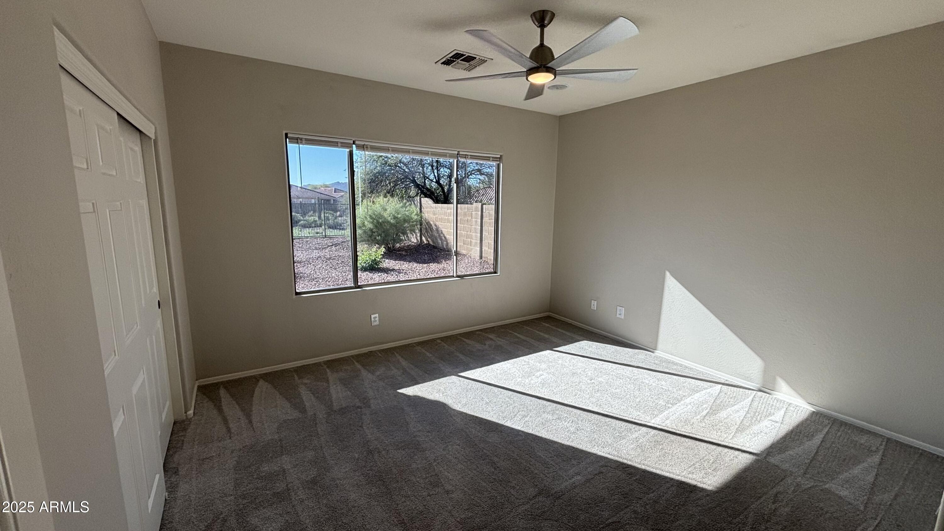 2587 West Patagonia Way Phoenix, AZ 85086 - Photo 7 of 19 a view of an empty room with a window