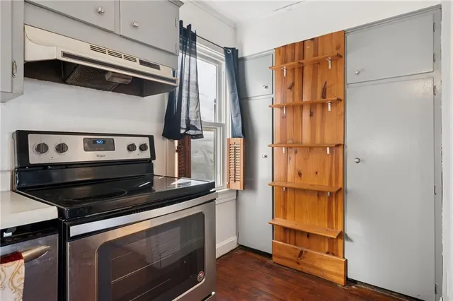 a kitchen with stainless steel appliances a refrigerator and a stove