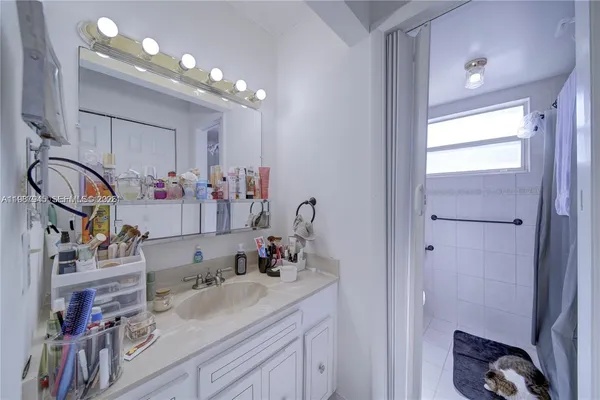 a bathroom with sink and mirror