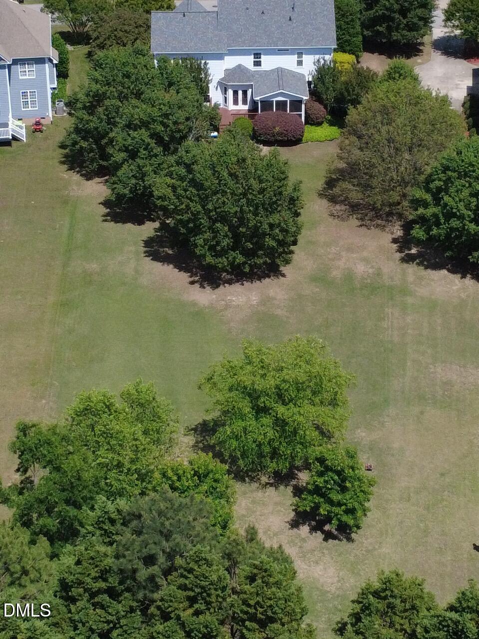 2908 Oak Bridge Drive Raleigh, NC 27610 - Photo 43 of 47 an aerial view of a house with a yard and lake view
