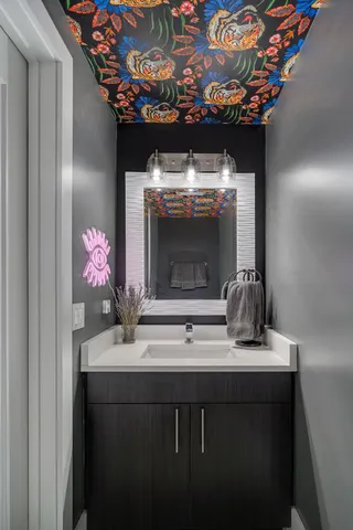 a bathroom with a sink and a mirror