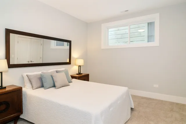 a bedroom with a bed and a tv