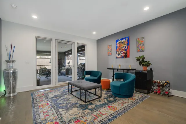 a living room with furniture and a rug