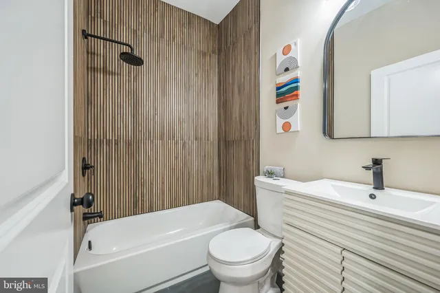 a bathroom with a sink a toilet and a bathtub