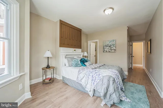 a bedroom with a bed and a table in it