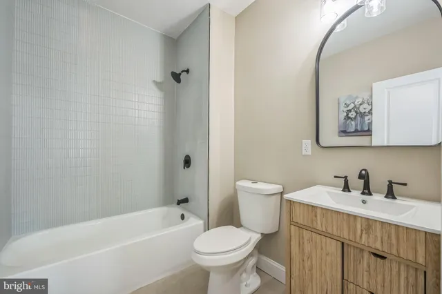 a bathroom with a toilet sink and bathtub