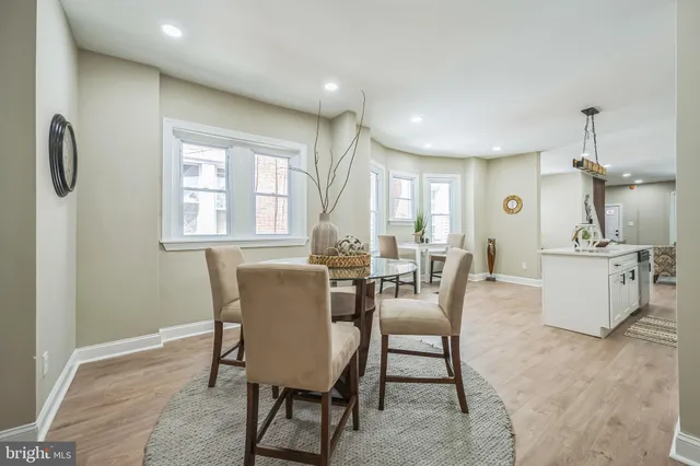 a view of a dining room with furniture and window