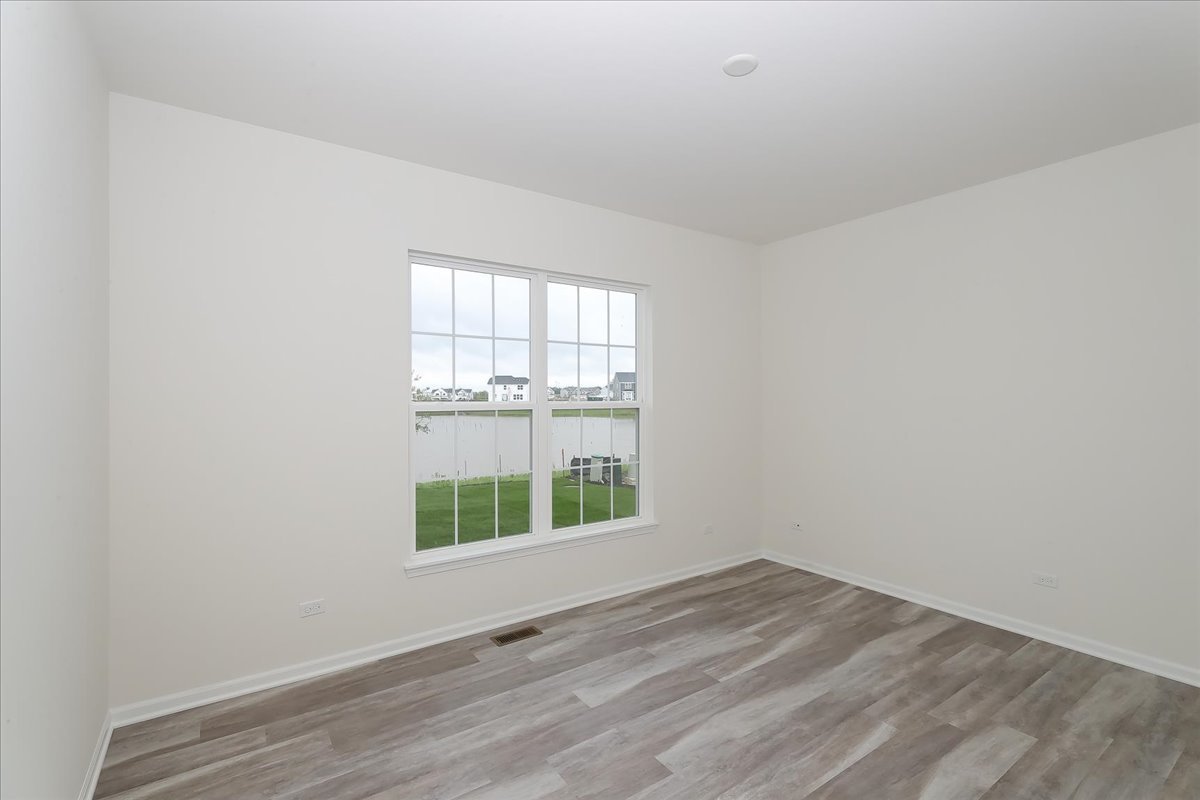 10782 Chadsey Road Huntley, IL 60142 - Photo 17 of 33 an empty room with a window