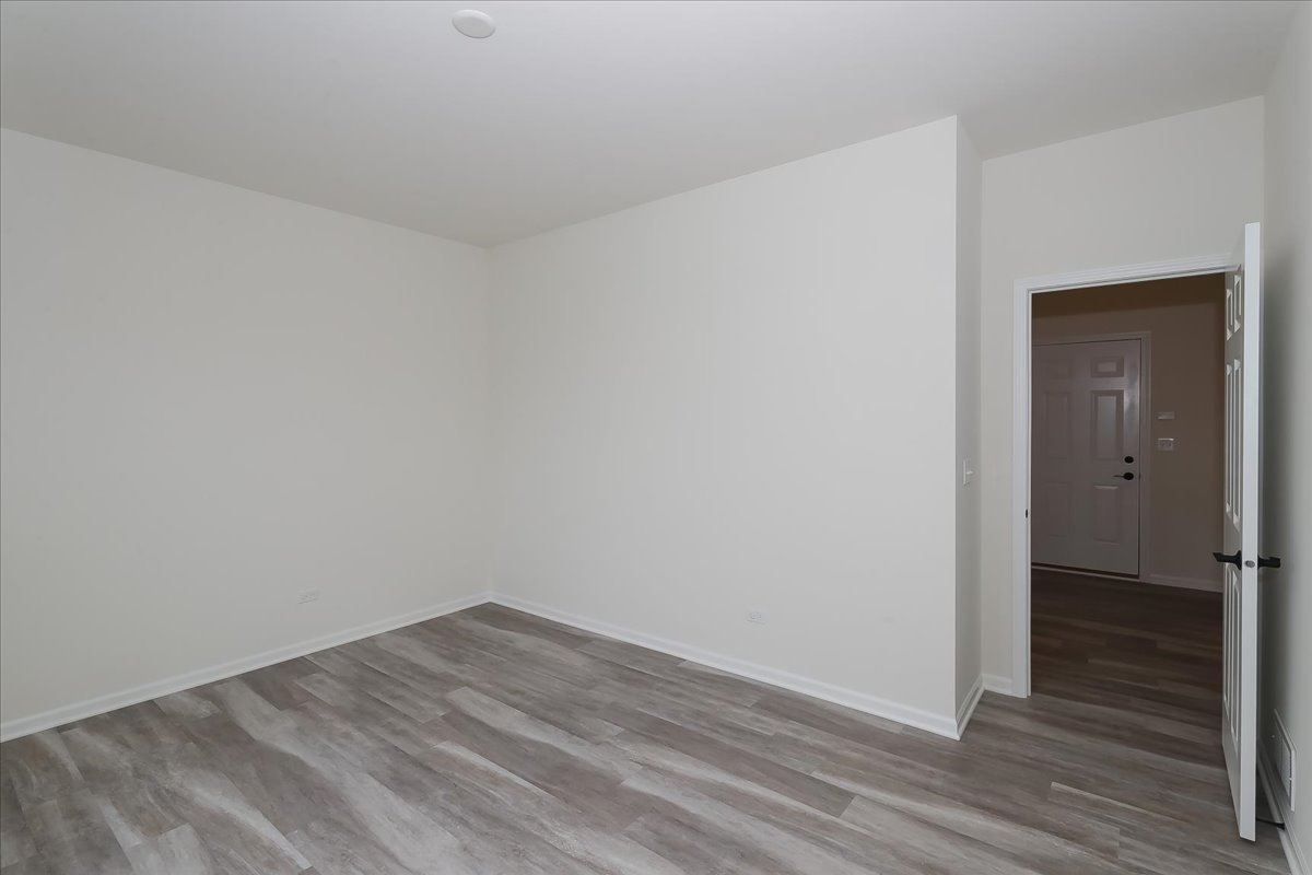 10782 Chadsey Road Huntley, IL 60142 - Photo 18 of 33 wooden floor in an empty room