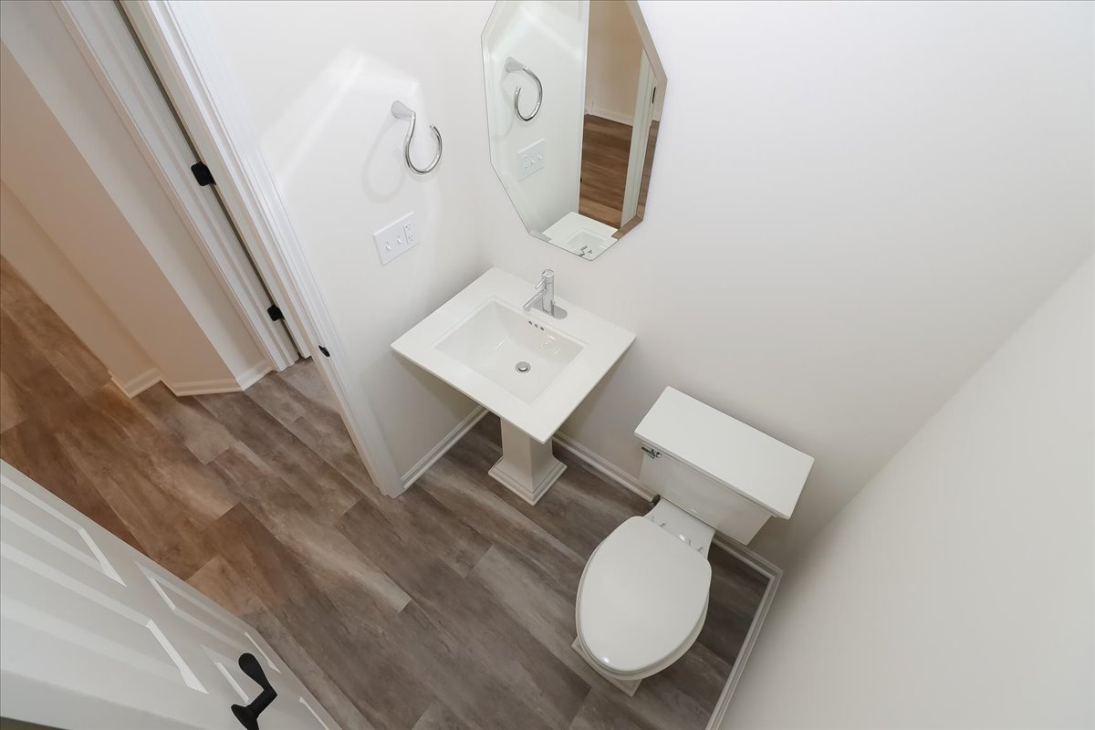 10782 Chadsey Road Huntley, IL 60142 - Photo 20 of 33 a bathroom with a toilet a sink and mirror