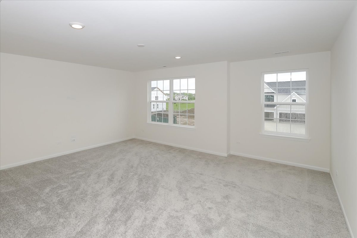 10782 Chadsey Road Huntley, IL 60142 - Photo 21 of 33 an empty room with windows