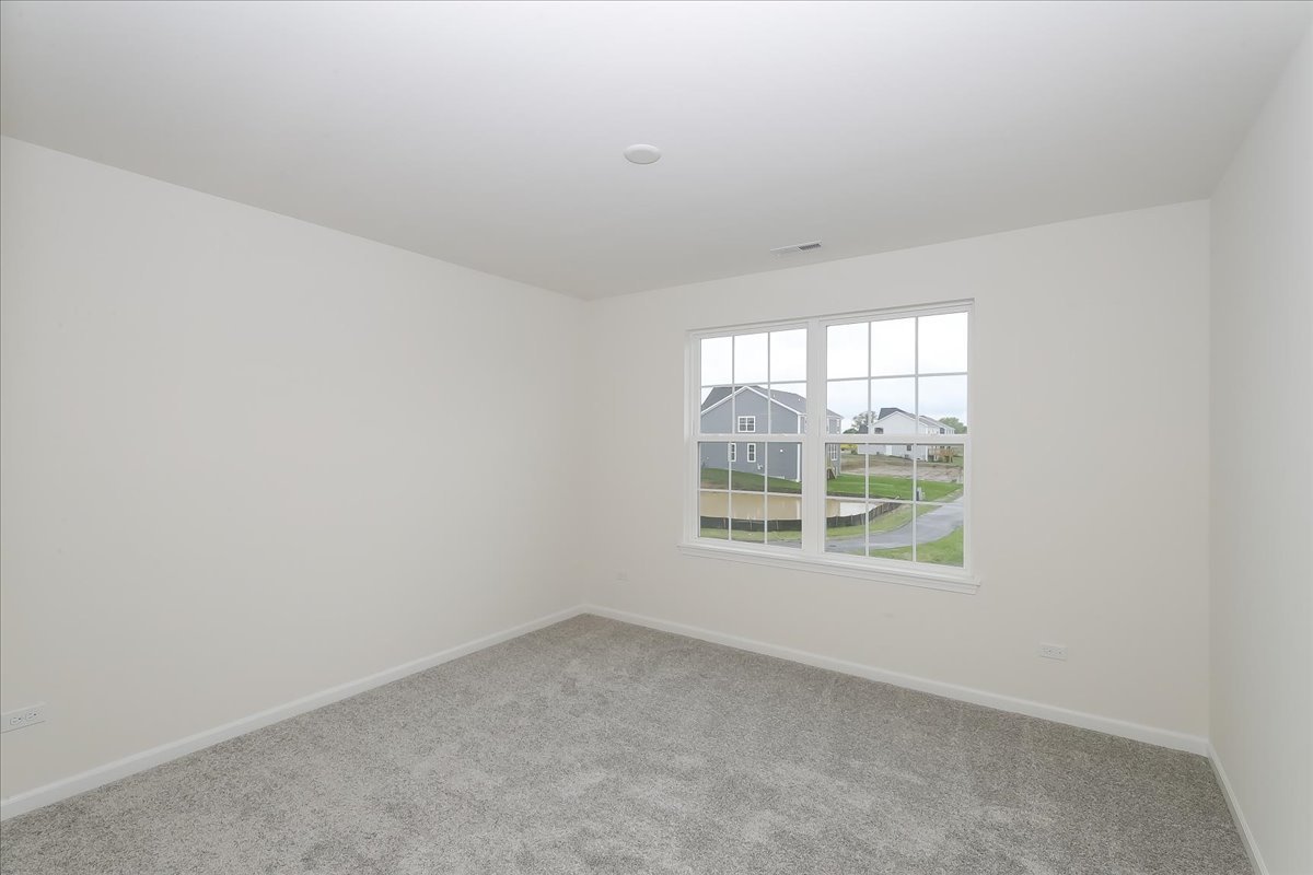 10782 Chadsey Road Huntley, IL 60142 - Photo 27 of 33 an empty room with a window