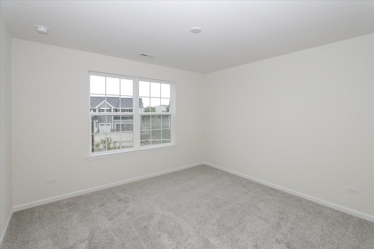 10782 Chadsey Road Huntley, IL 60142 - Photo 30 of 33 an empty room with a window