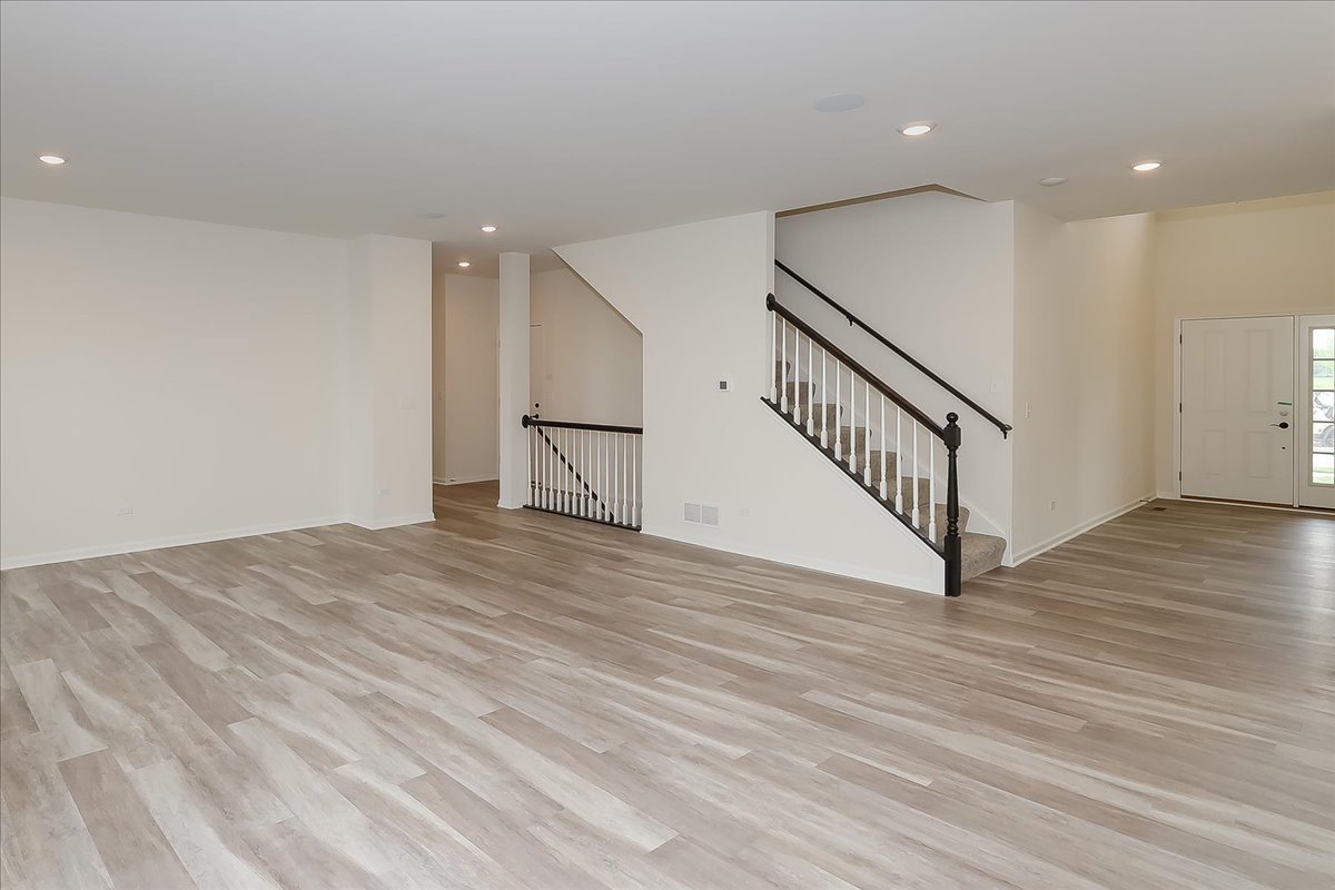 10782 Chadsey Road Huntley, IL 60142 - Photo 7 of 33 a view of empty room with wooden floor
