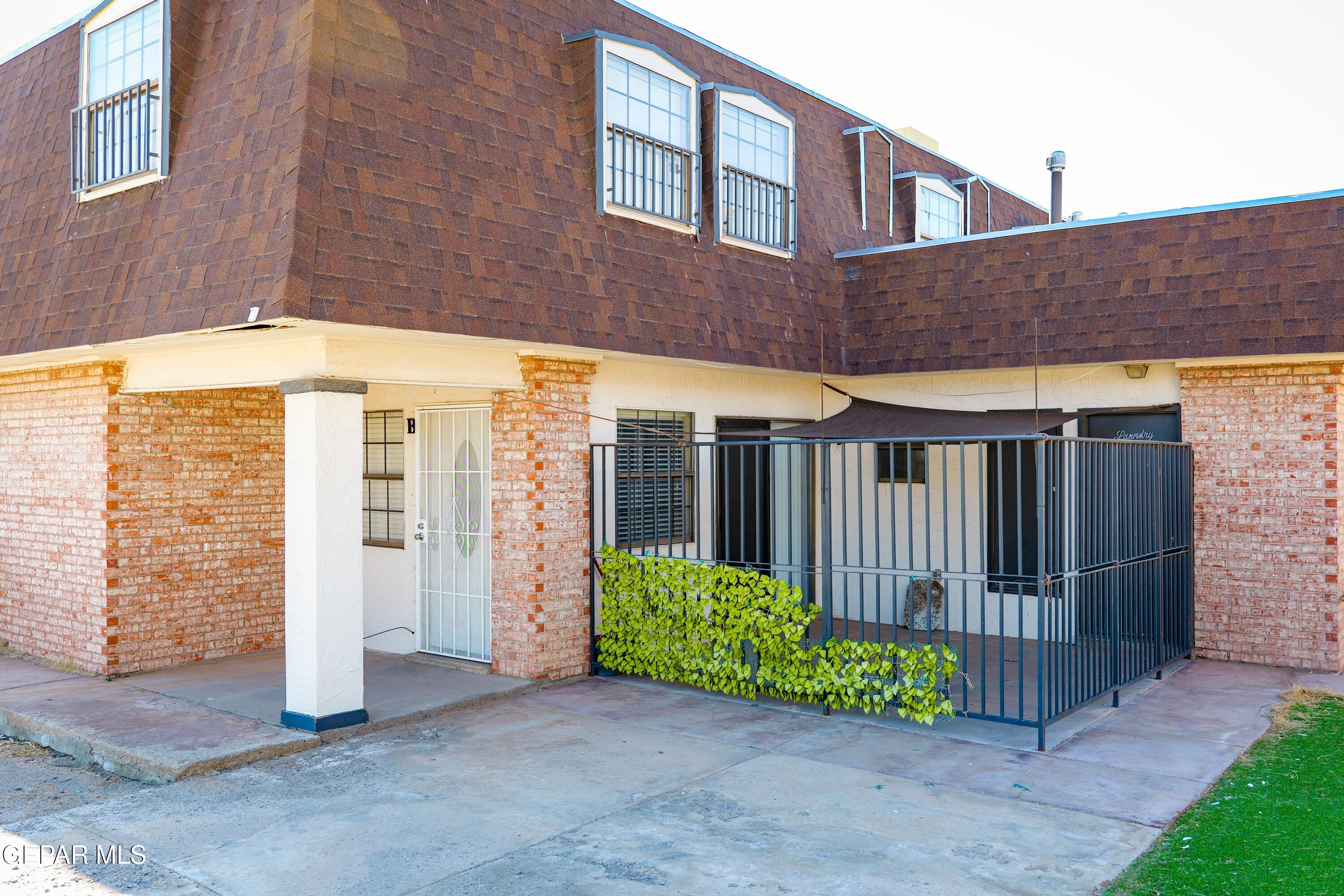 10818 Ivanhoe Drive, Unit B El Paso, TX 79935 - Photo 1 of 1 a front view of a house with a garden