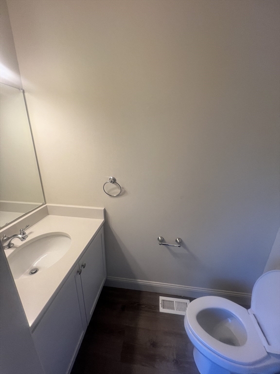 51 Everit Avenue, Unit B Framingham, MA 01702 - Photo 12 of 14 a bathroom with a granite countertop sink and a toilet