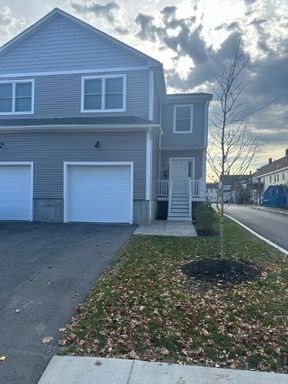 51 Everit Avenue, Unit B Framingham, MA 01702 - Photo 2 of 14 a view of a house with a yard