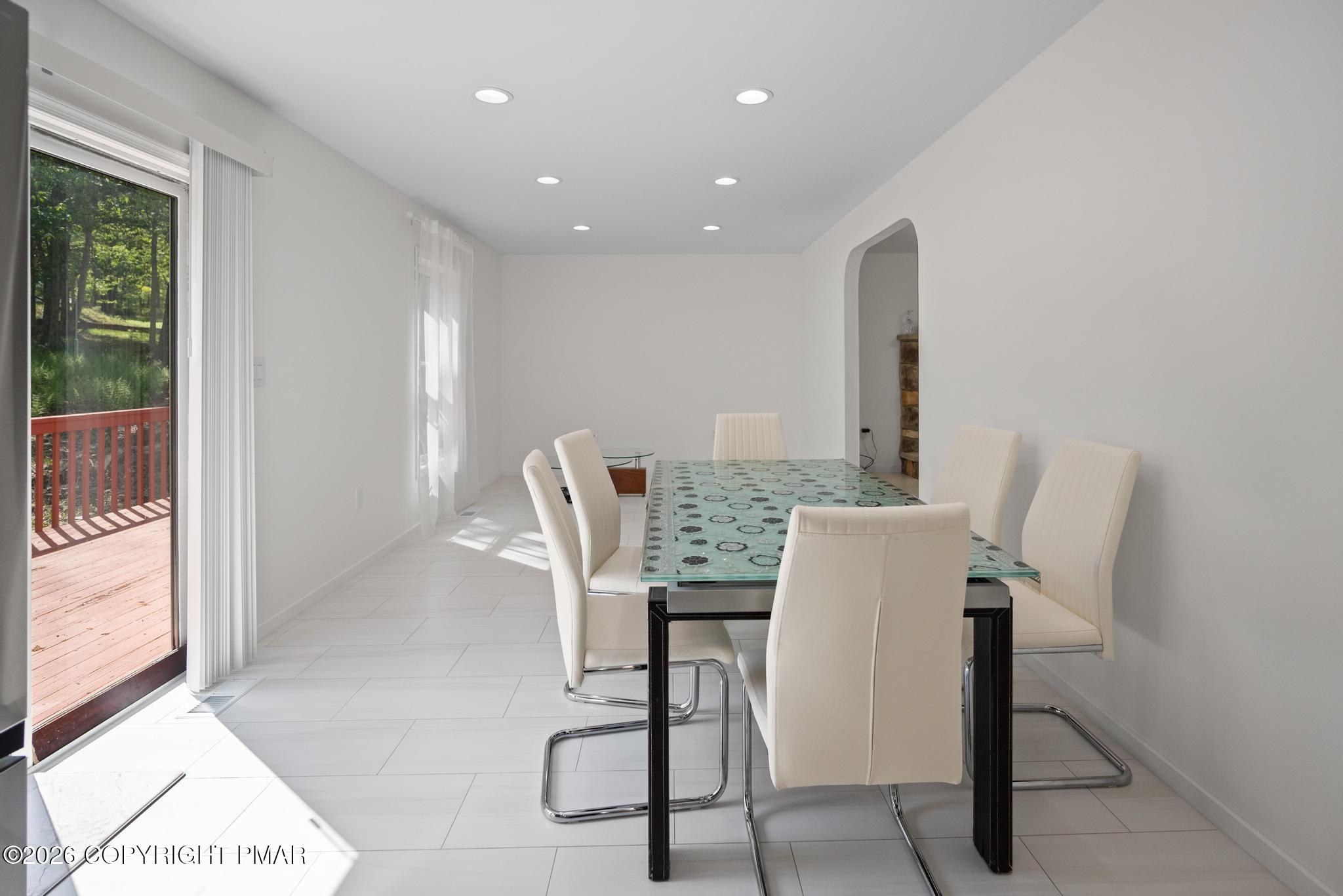 2312 Cramer Court Bushkill, PA 18324 - Photo 15 of 37 a view of a dining room with furniture and a potted plant