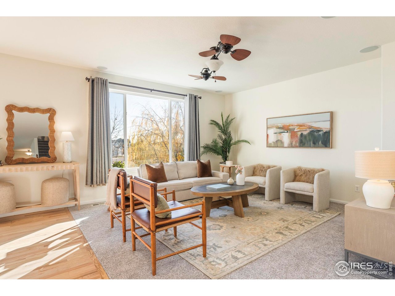 13420 Spruce Street Thornton, CO 80602 - Photo 13 of 48 a living room with furniture and a large window