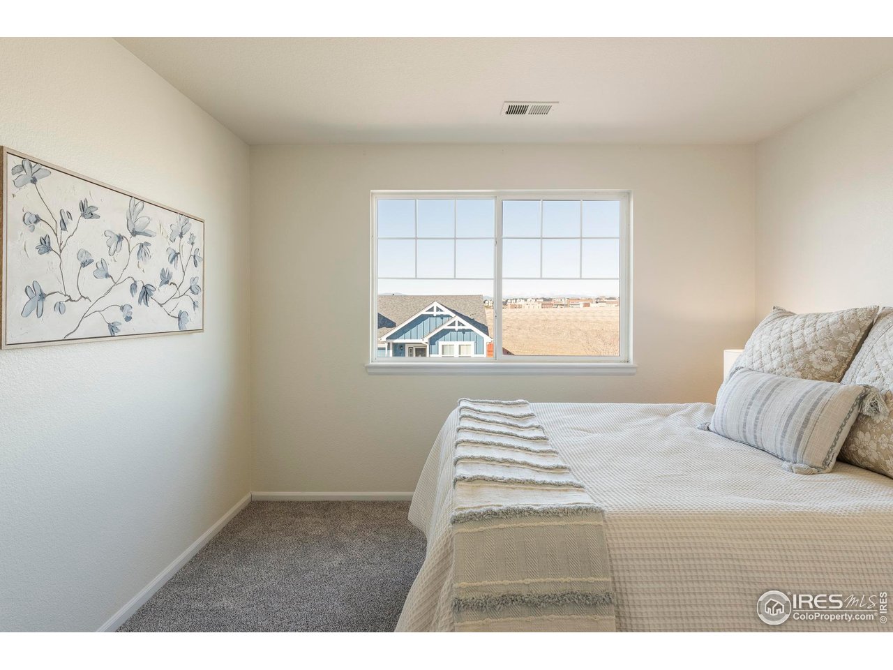 13420 Spruce Street Thornton, CO 80602 - Photo 26 of 48 a bedroom with a bed and a window