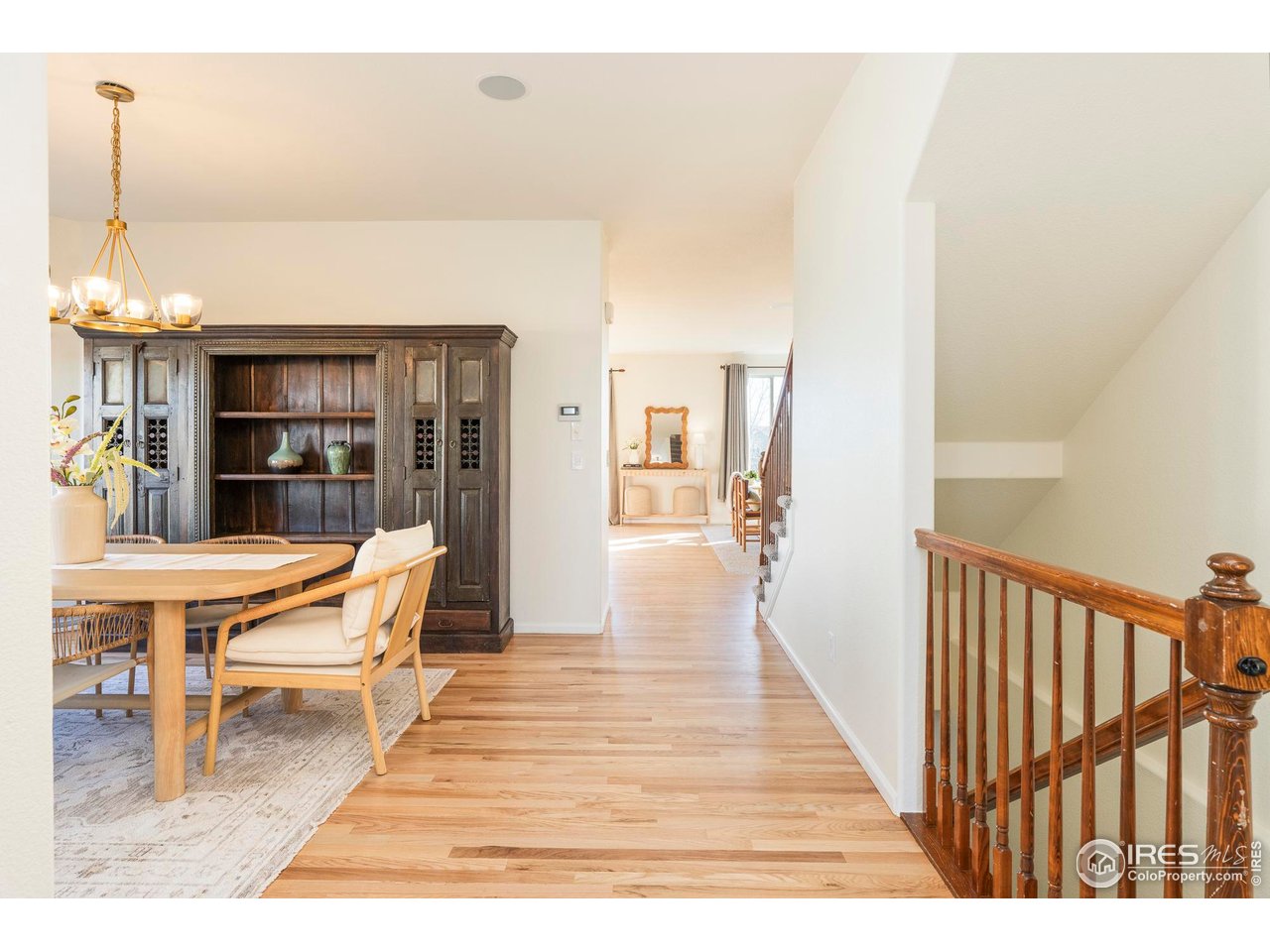 13420 Spruce Street Thornton, CO 80602 - Photo 4 of 48 a living room with furniture a dining table and chairs