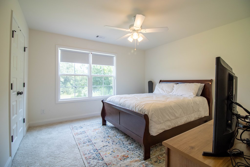 25 Veterans Court Fort Mitchell, AL 36856 - Photo 17 of 32 a large bed sitting in a room next to a window
