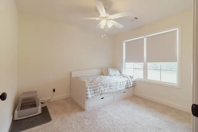 a room with a bed and a window