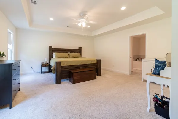 a bed room with a bed and a television