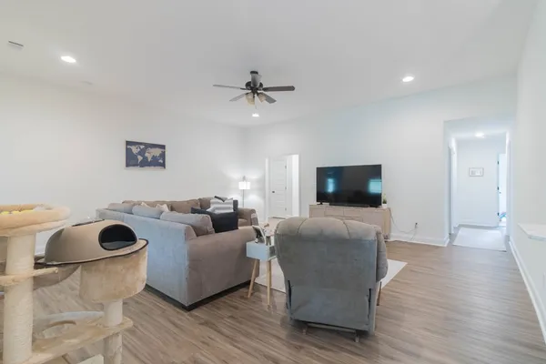 a living room with furniture and a flat screen tv