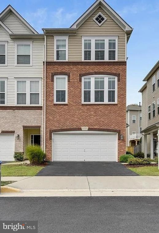 Charming brick-front townhouse with curb appeal.