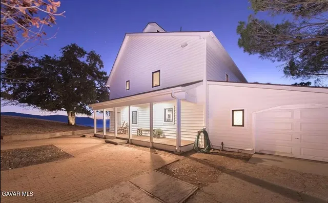 a view of a building with a yard