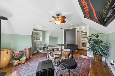 a living room with furniture potted plant and a chandelier