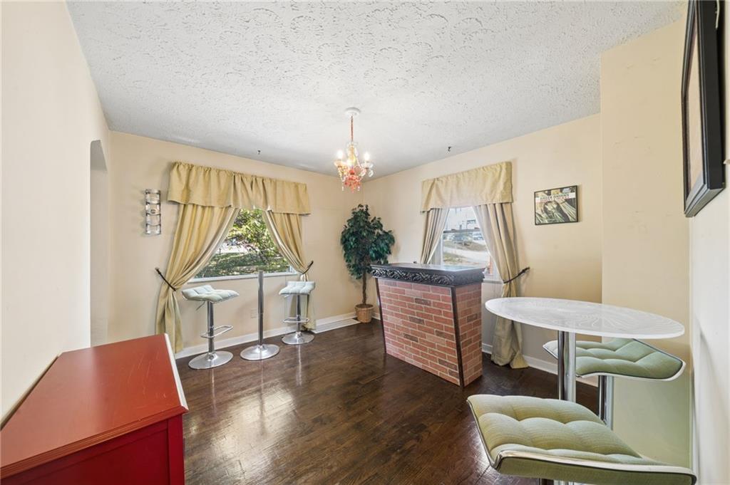1320 Lebanon Church Road Pittsburgh, PA 15236 - Photo 8 of 31 a living room with furniture a window and wooden floor