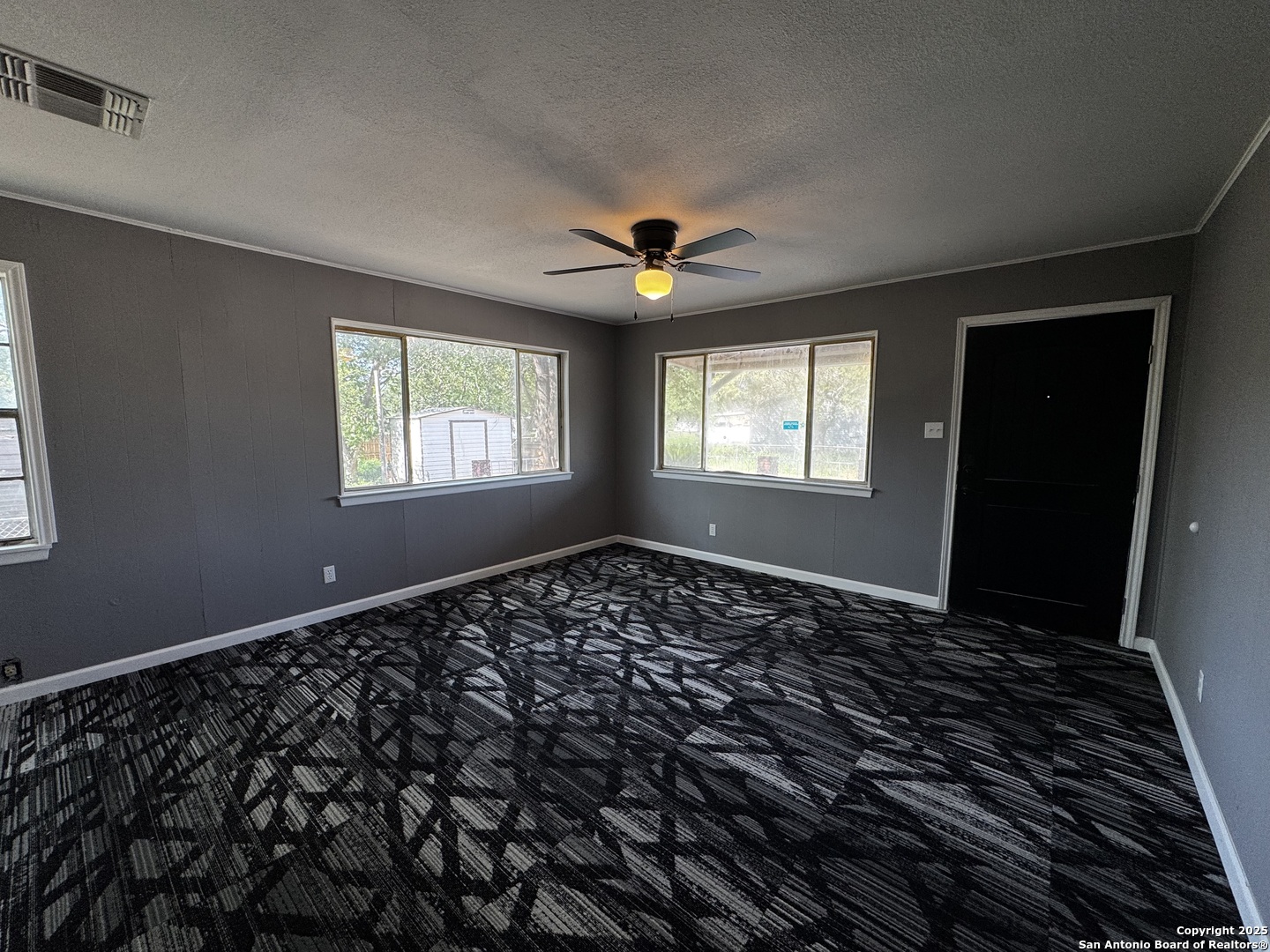 19518 Florence Street Lytle, TX 78052 - Photo 11 of 16 wooden floor in an empty room with a window