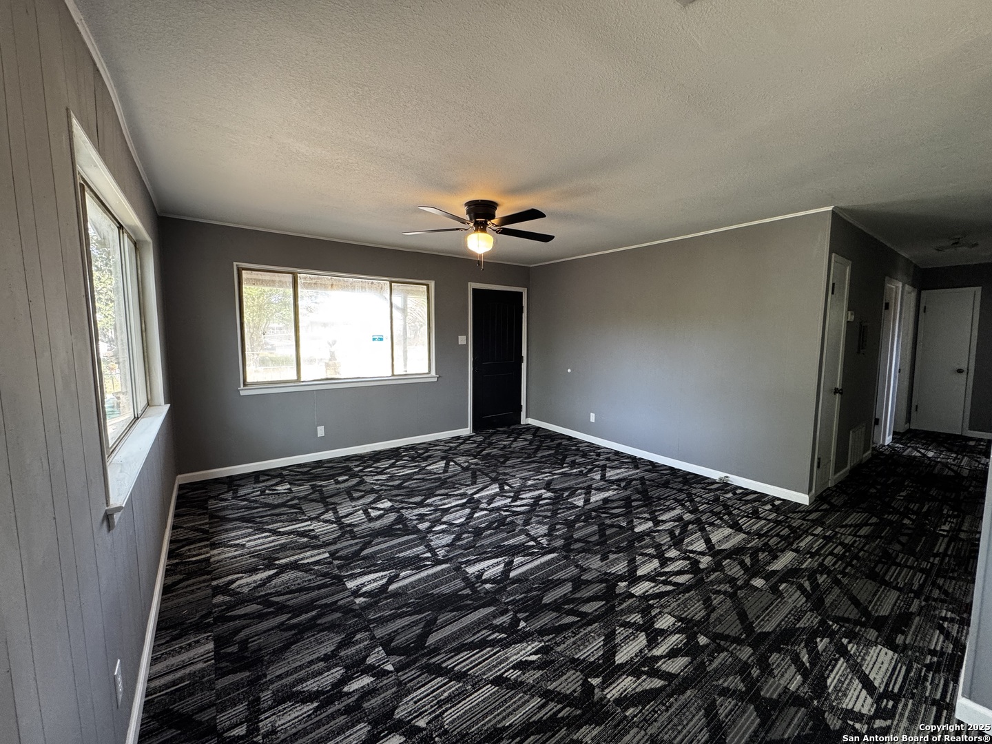 19518 Florence Street Lytle, TX 78052 - Photo 12 of 16 a view of a livingroom with a ceiling fan and window