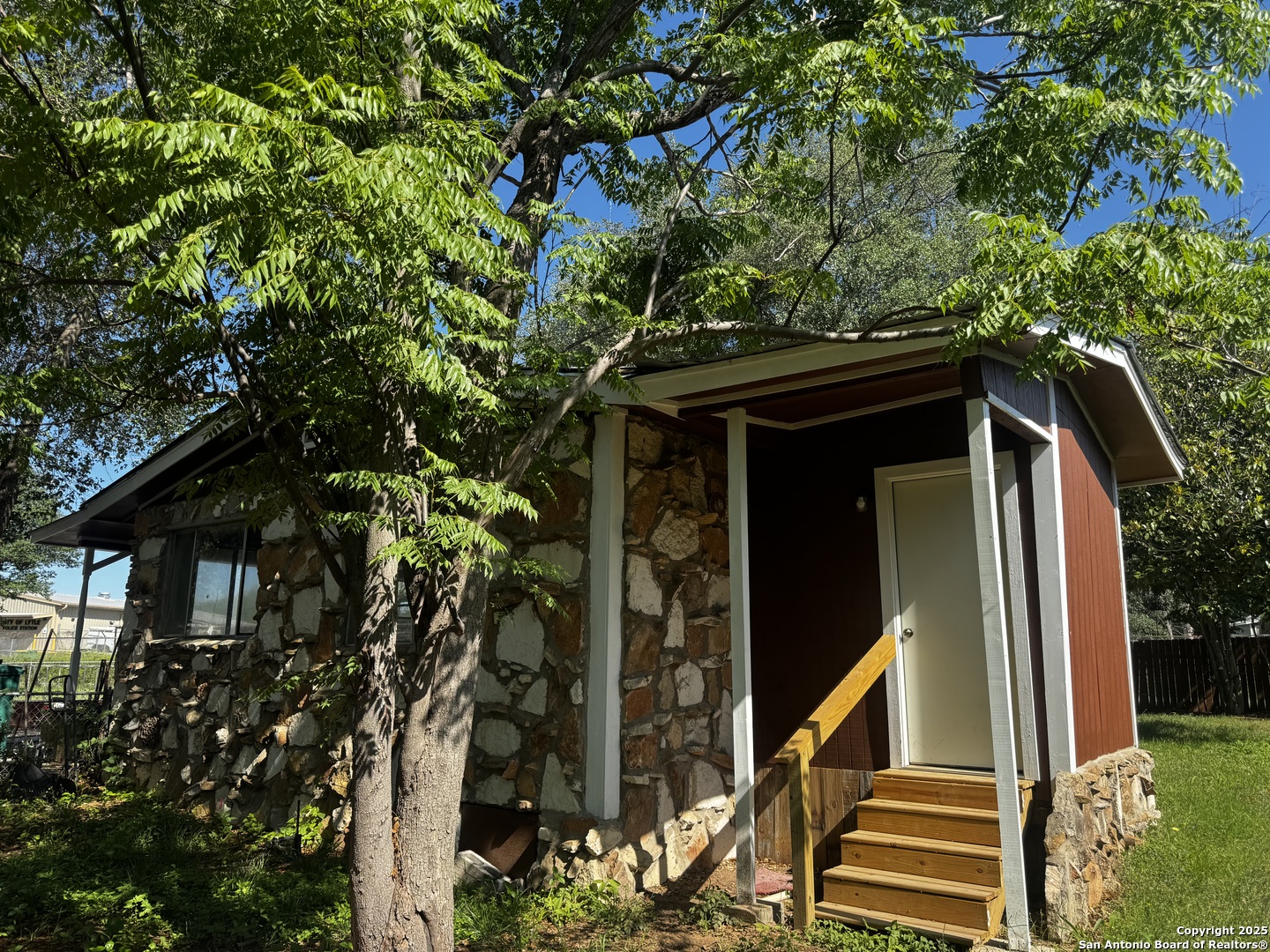 19518 Florence Street Lytle, TX 78052 - Photo 5 of 16 a view of a house with a tree