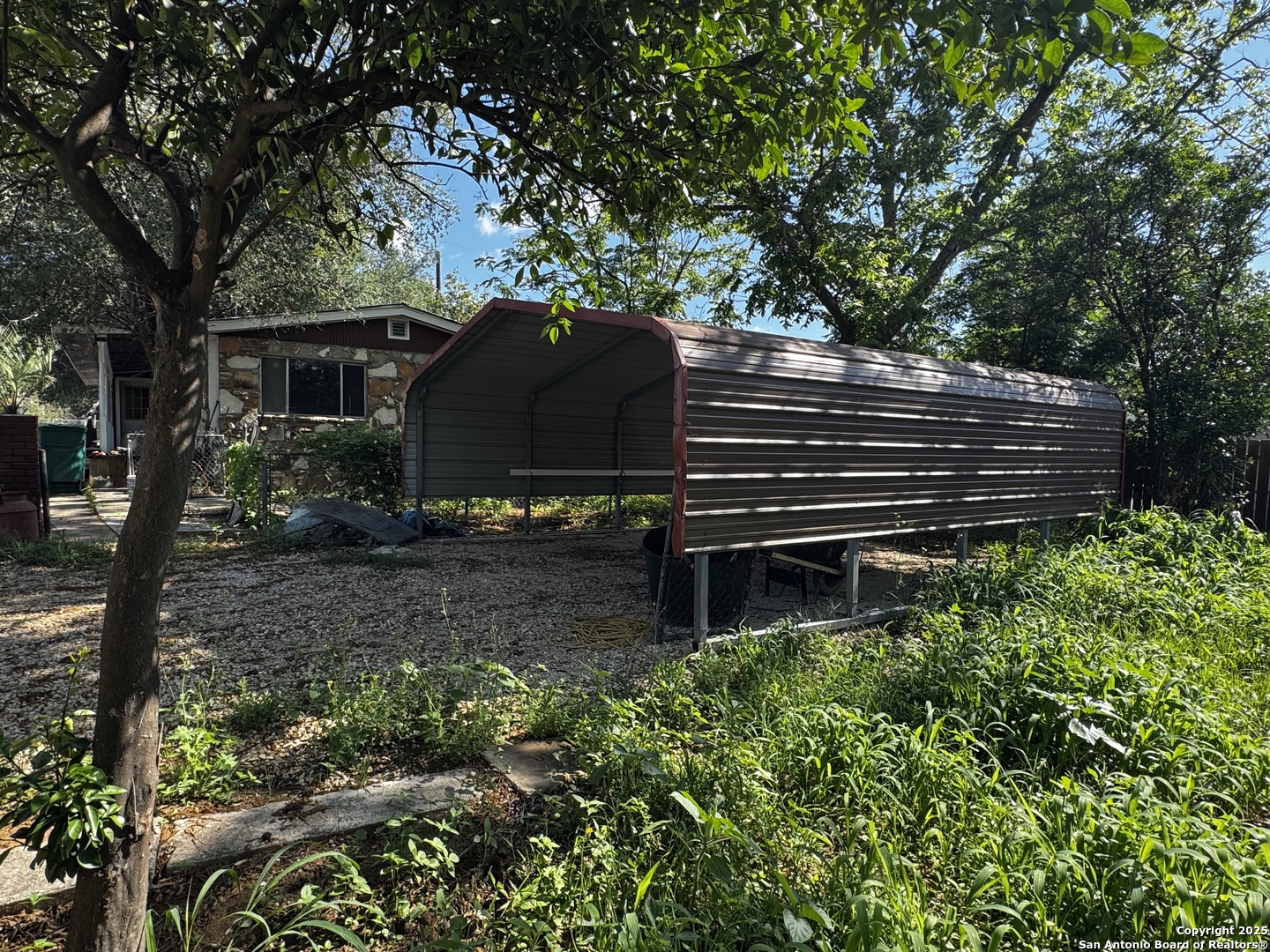 19518 Florence Street Lytle, TX 78052 - Photo 6 of 16 a front view of a house with a garden