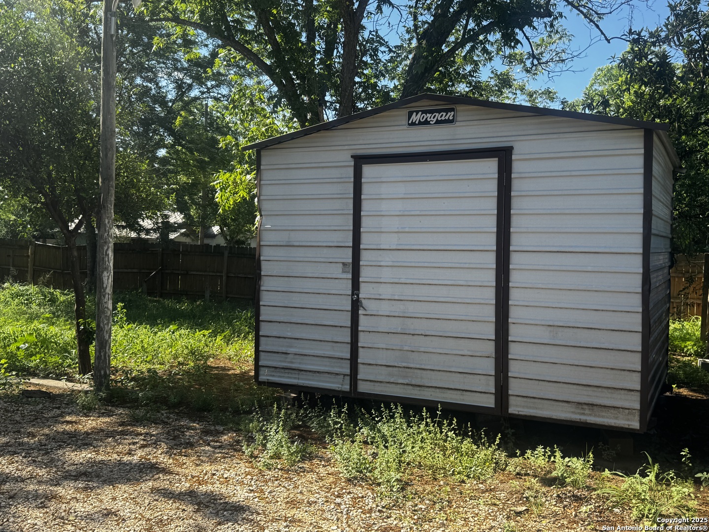 19518 Florence Street Lytle, TX 78052 - Photo 7 of 16 a view of a back yard of the house