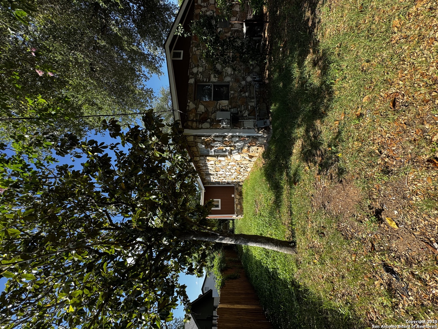 19518 Florence Street Lytle, TX 78052 - Photo 8 of 16 a view of a house with a tree