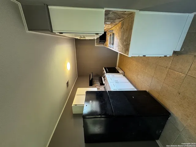 a view of a living room with furniture