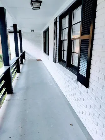 a view of a hallway with windows