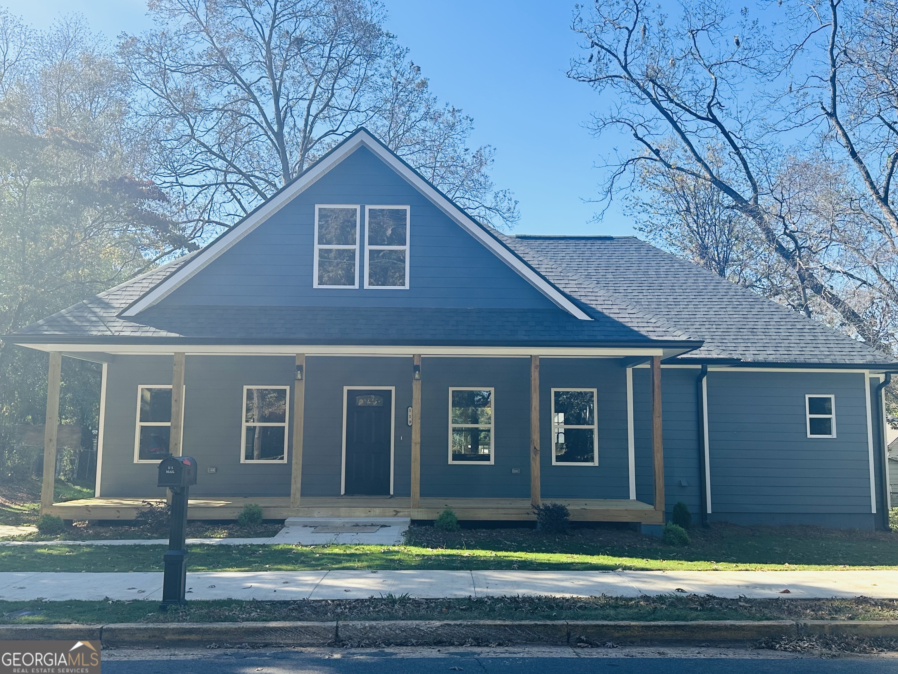a front view of a house with garage