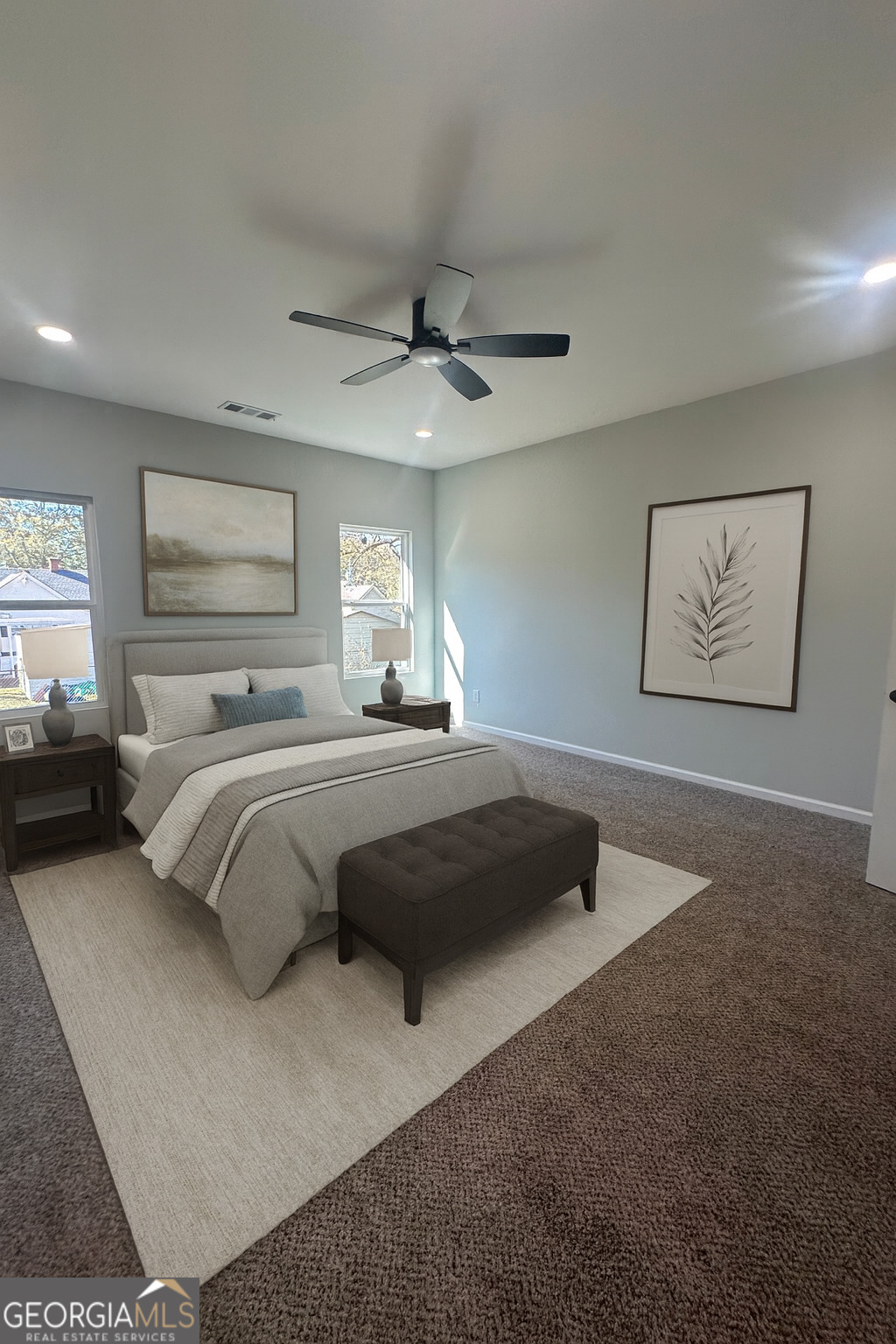 119 F Street Thomaston, GA 30286 - Photo 13 of 27 a bedroom with a bed and a chandelier