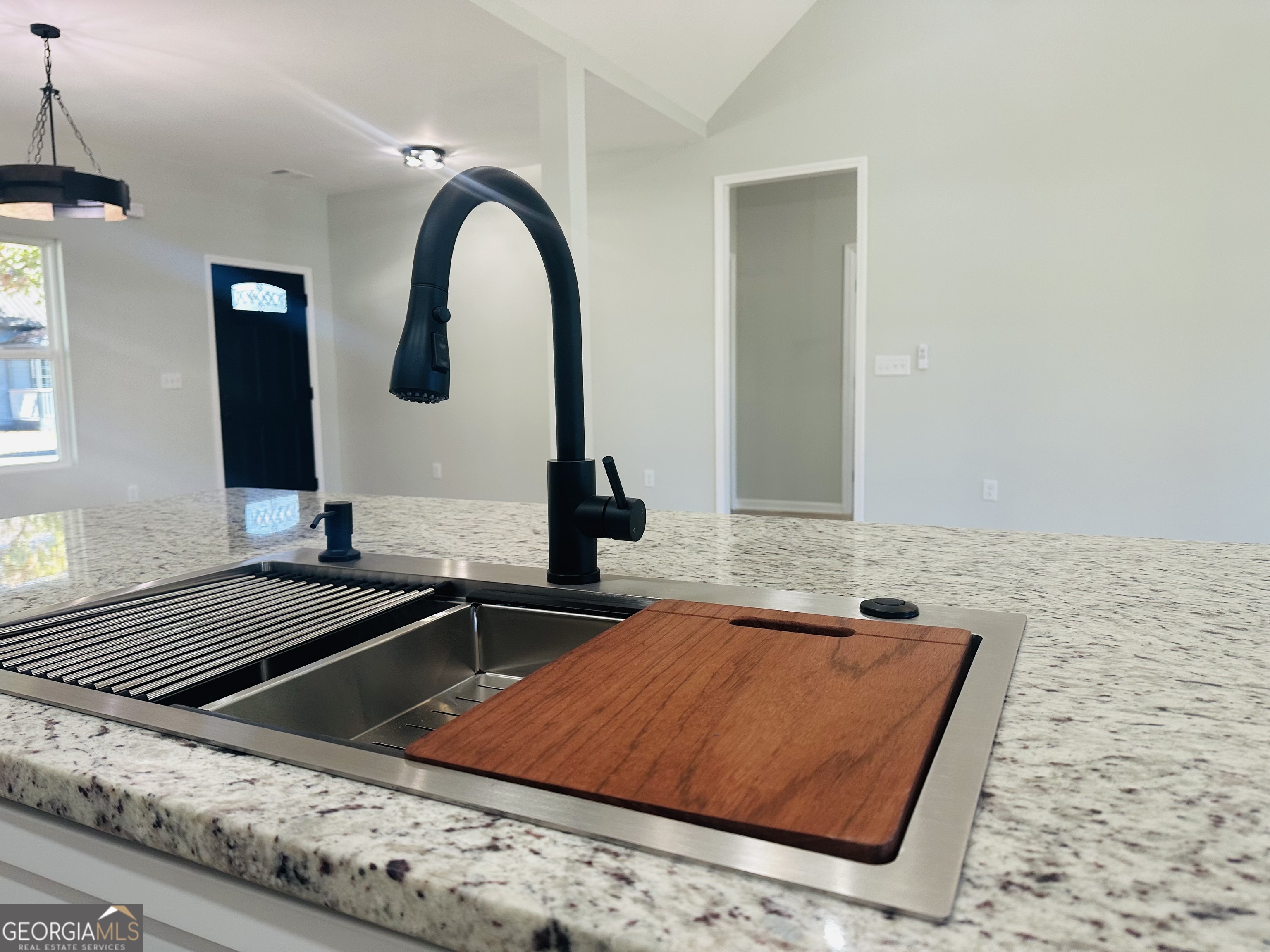 119 F Street Thomaston, GA 30286 - Photo 5 of 27 a kitchen with a sink and a stove