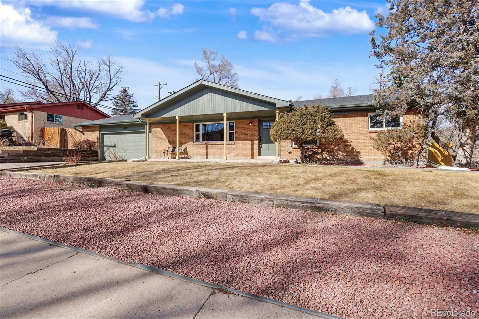 1002 Milky Way Colorado Springs, CO 80905 - Photo 1 of 39 a front view of a house with a yard