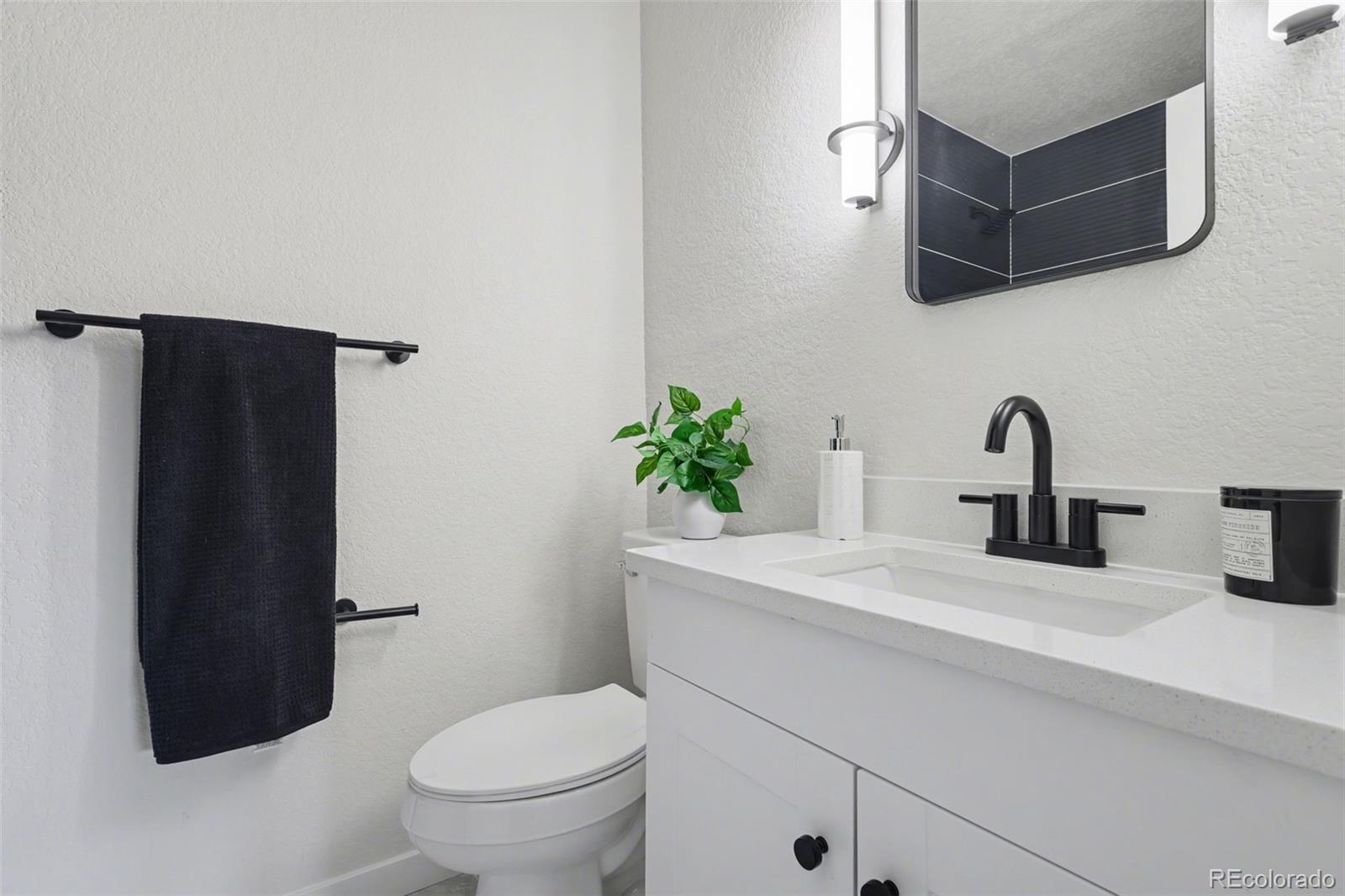 1002 Milky Way Colorado Springs, CO 80905 - Photo 13 of 39 a bathroom with a sink toilet and shower