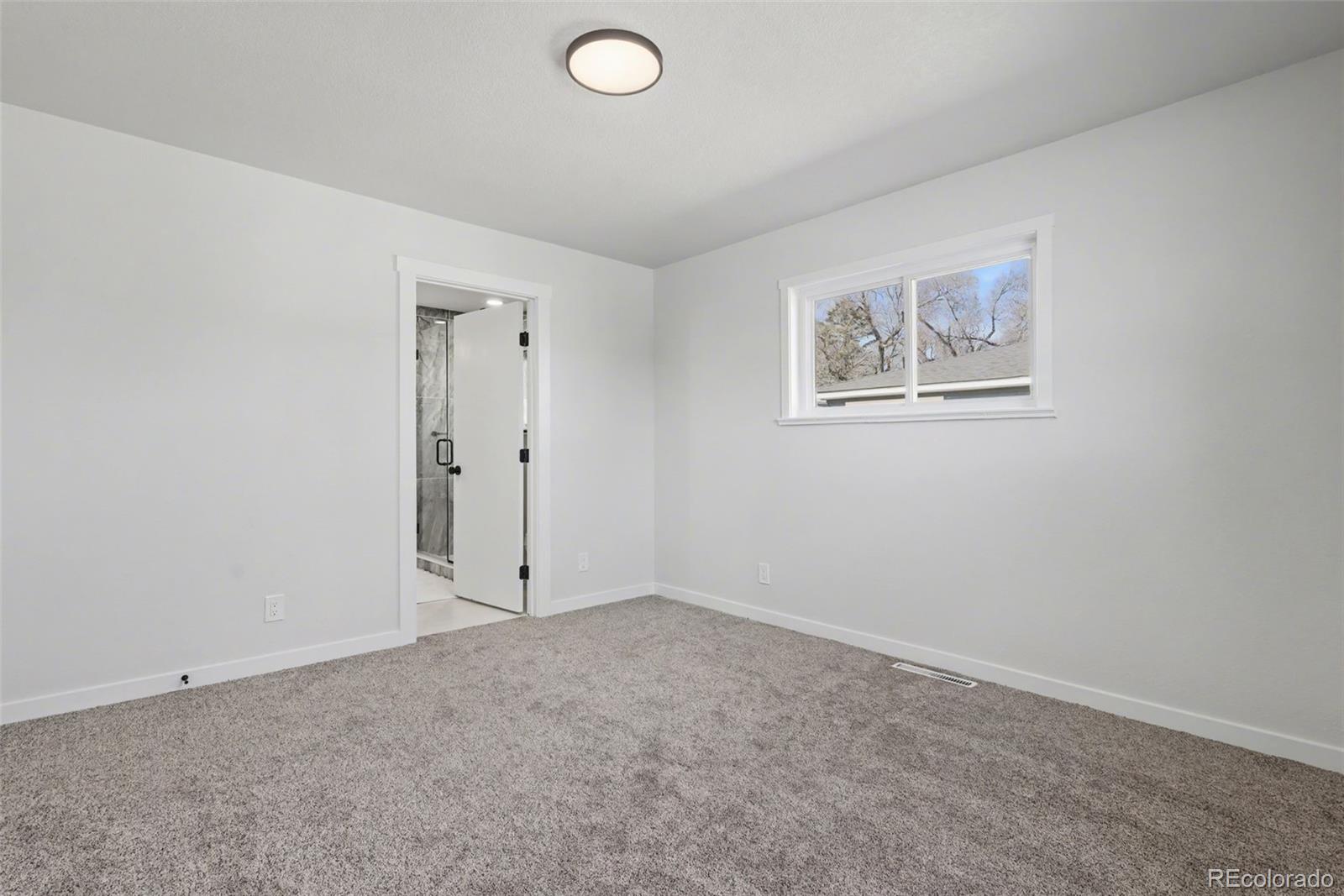 1002 Milky Way Colorado Springs, CO 80905 - Photo 15 of 39 an empty room with windows